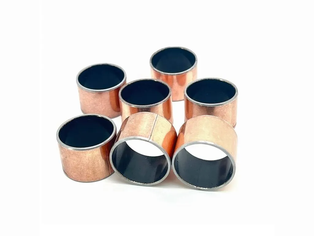Bạc lót composite lưng thép: Sáu bạc SF-1 lưng thép tráng đồng xếp chụm, lòng đen