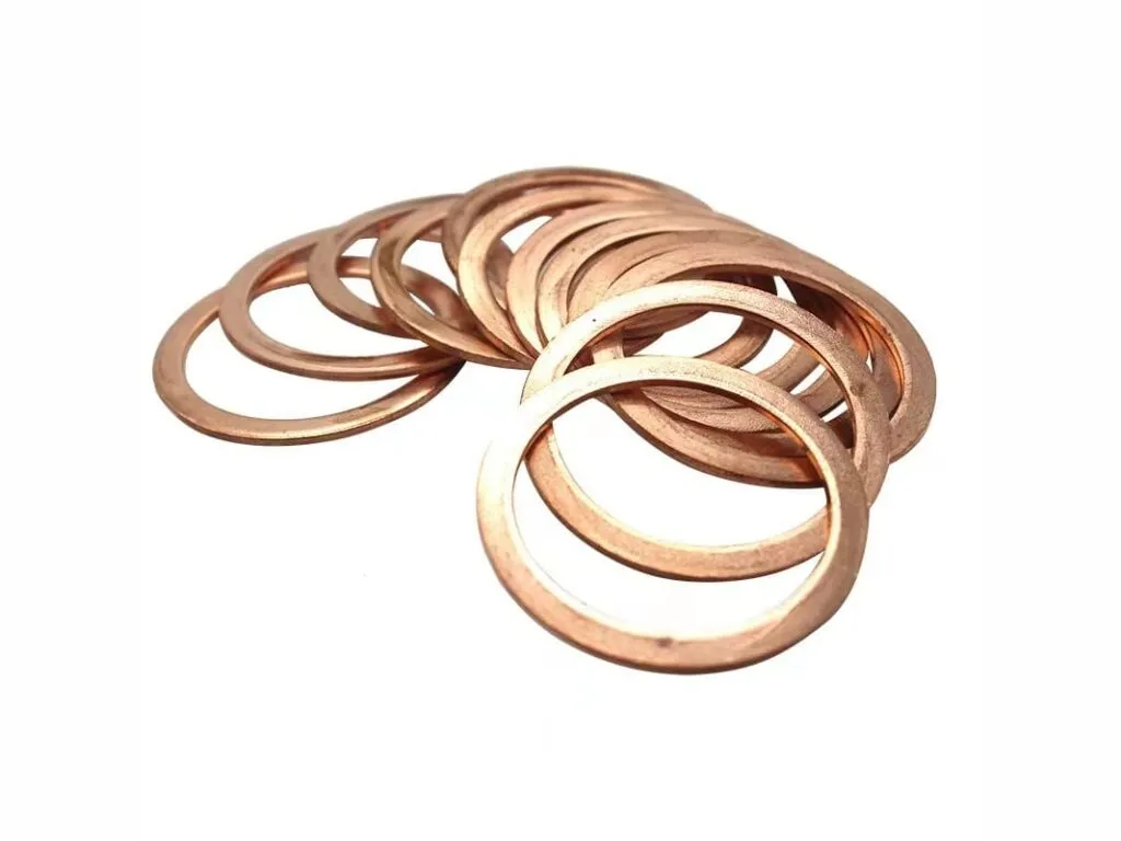 Gioăng kim loại đặc: Các vòng đệm đồng đỏ mỏng xếp nghiêng, đường kính lớn nhỏ