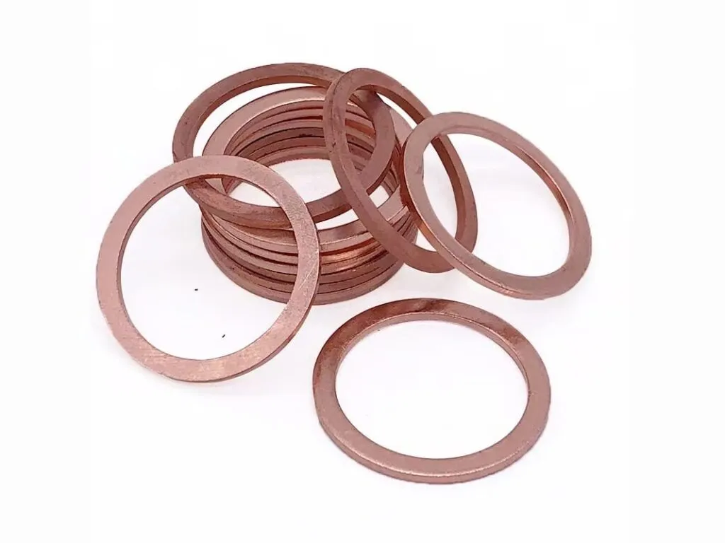 Gioăng kim loại đặc: Chồng vòng đệm đồng đỏ phẳng nhiều cỡ xếp chồng lên nhau