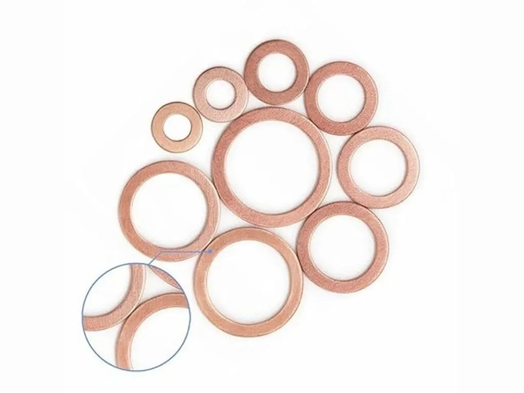 Gioăng kim loại đặc: Nhiều vòng đệm đồng đỏ phẳng nhiều cỡ xếp chồng lên nhau