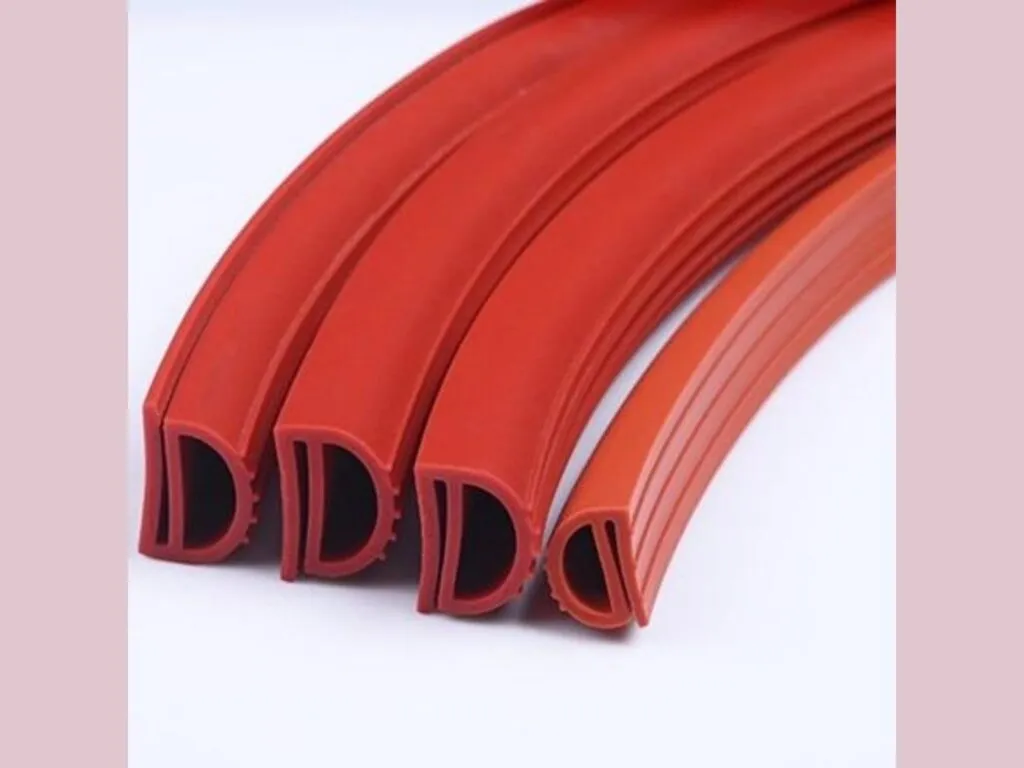 Gioăng silicon: Bốn dải gioăng silicone đỏ định hình chữ D uốn cong cạnh nhau