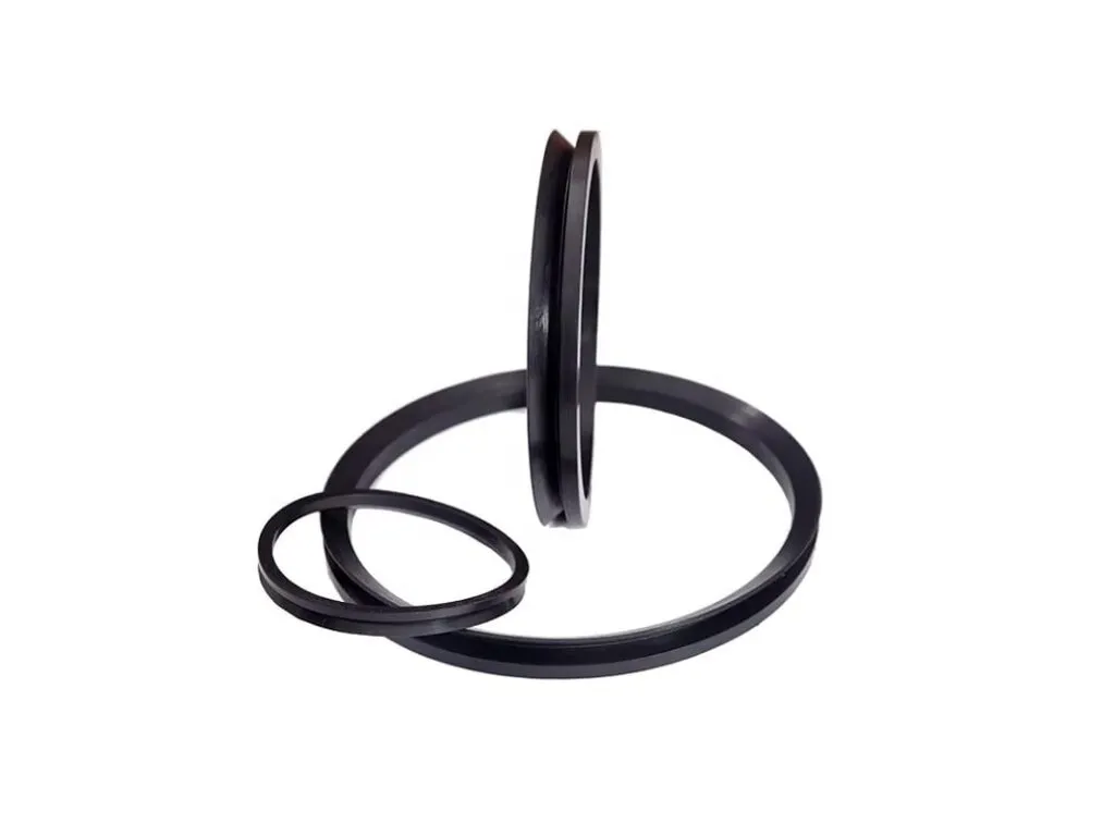 Phớt V-ring VA, VS: V-ring đen dựng đứng cạnh một vòng nằm, thấy tiết diện chữ V